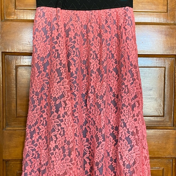 Rose colored lace Lola over a dusty blue skirt.
